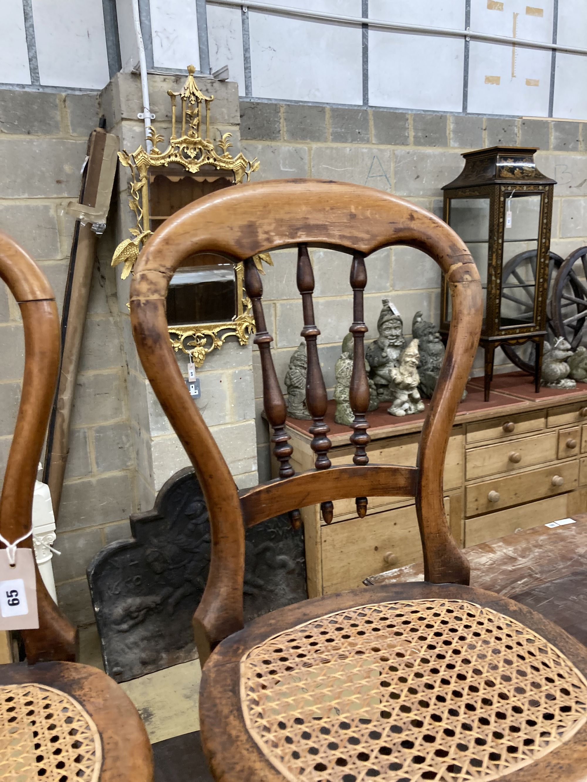 A pair of Victorian spindle back cane seat correction chairs